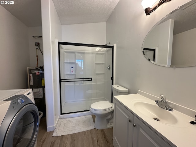 full bath with a textured ceiling, washer / dryer, a shower stall, wood finished floors, and electric water heater