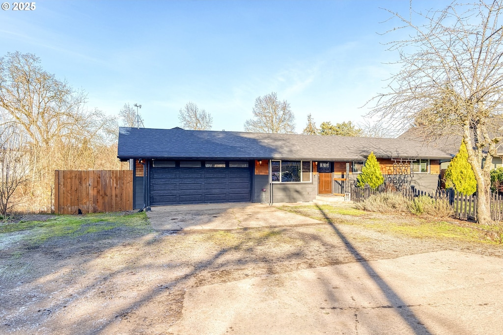 ranch-style home featuring a garage