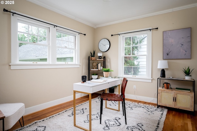 office space with dark wood-type flooring, a wealth of natural light, and crown molding