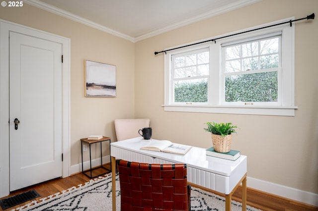 home office with crown molding and hardwood / wood-style floors