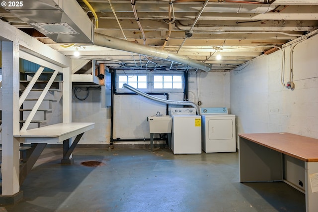 basement with separate washer and dryer and sink