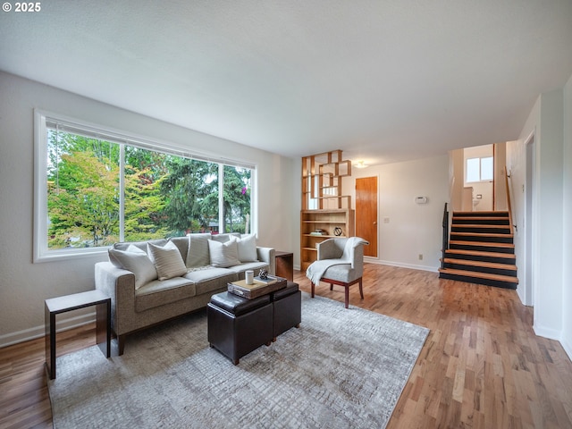2625 Potter St, Eugene, OR 97405 - living room with baseboards, light wood finished floors, and stairs