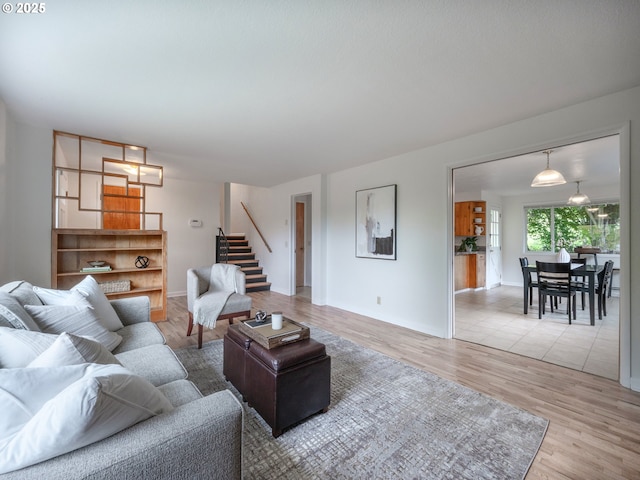 2625 Potter St, Eugene, OR 97405 - living area featuring stairway, light wood finished floors, and baseboards