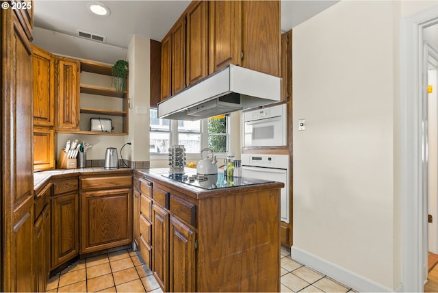 kitchen featuring open shelves, light tile patterned floors, white oven, and premium range hood