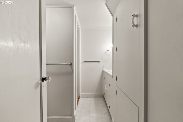 bathroom with vanity, tile patterned floors, and baseboards