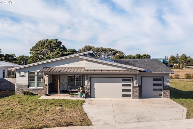 view of front of house with a garage, a patio area, and a front yard