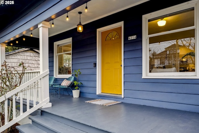 property entrance with covered porch