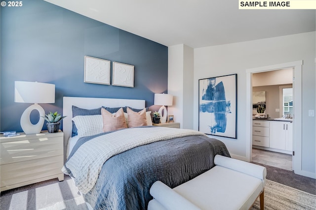 carpeted bedroom with ensuite bathroom