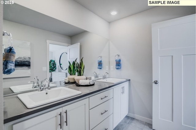 bathroom with vanity and tile patterned flooring