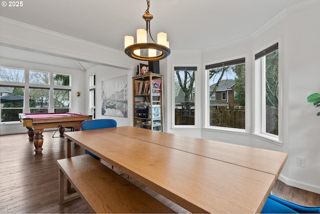 unfurnished dining area featuring a chandelier, ornamental molding, billiards, and dark hardwood / wood-style floors