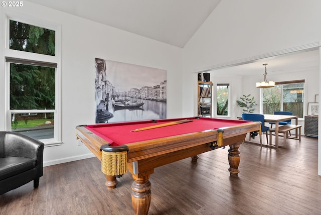 rec room with billiards, an inviting chandelier, high vaulted ceiling, and hardwood / wood-style flooring