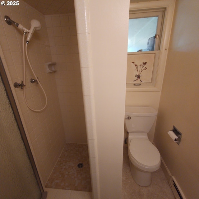 full bathroom with baseboard heating, a stall shower, toilet, tile patterned floors, and baseboards