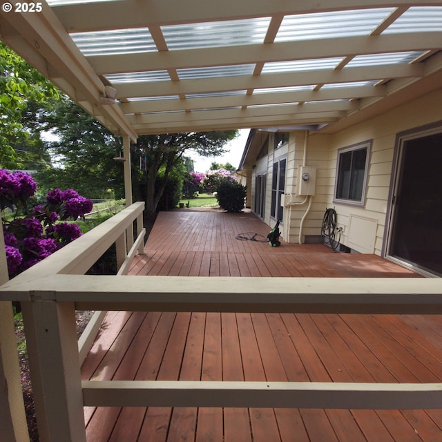 wooden deck featuring a pergola