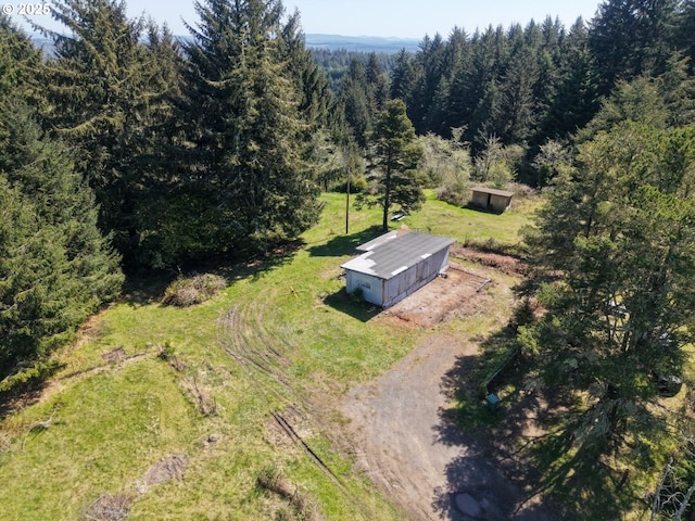 drone / aerial view with a view of trees