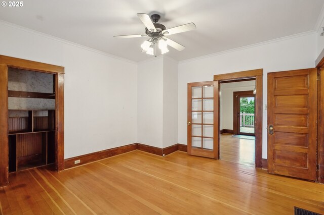 unfurnished room with hardwood / wood-style flooring, ceiling fan, and ornamental molding