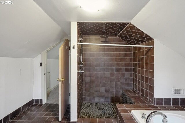 bathroom featuring separate shower and tub and lofted ceiling