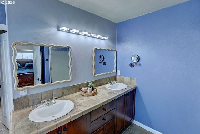 16295 SE Slate St, Damascus, OR 97089 - full bathroom featuring double vanity, baseboards, and tile patterned floors