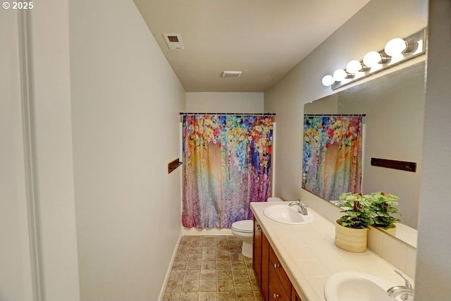 16295 SE Slate St, Damascus, OR 97089 - full bath with baseboards, double vanity, toilet, and curtained shower