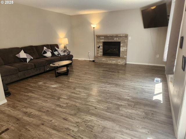 6307 NE Wilding Rd, Vancouver, WA 98686 - living area featuring wood finished floors and a brick fireplace