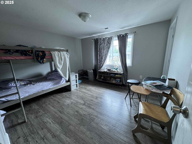 6307 NE Wilding Rd, Vancouver, WA 98686 - bedroom featuring a textured ceiling and wood finished floors