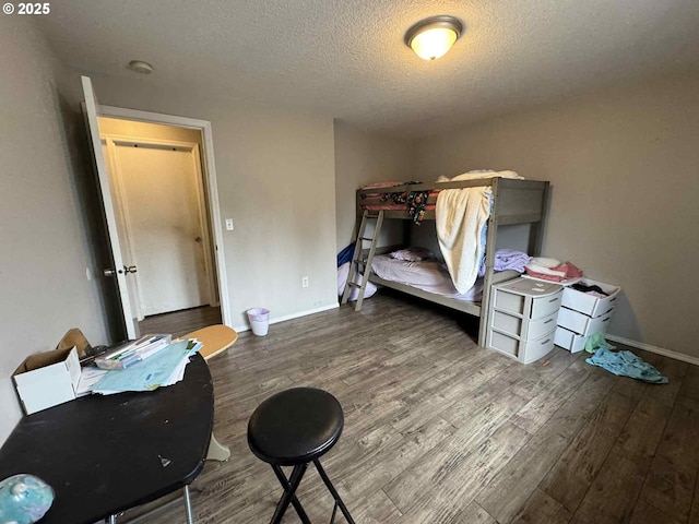 6307 NE Wilding Rd, Vancouver, WA 98686 - bedroom with wood finished floors and a textured ceiling