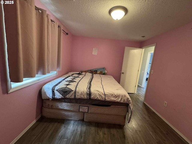 6307 NE Wilding Rd, Vancouver, WA 98686 - bedroom with a textured ceiling and dark wood-style floors