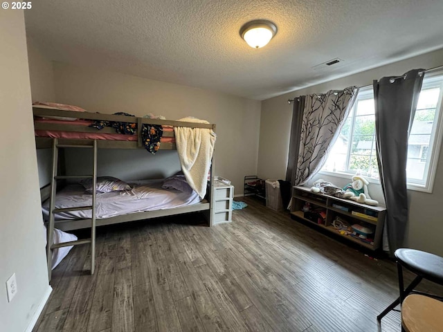 6307 NE Wilding Rd, Vancouver, WA 98686 - bedroom featuring a textured ceiling and wood finished floors