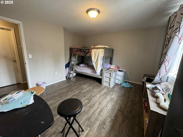 6307 NE Wilding Rd, Vancouver, WA 98686 - bedroom with wood finished floors and a textured ceiling