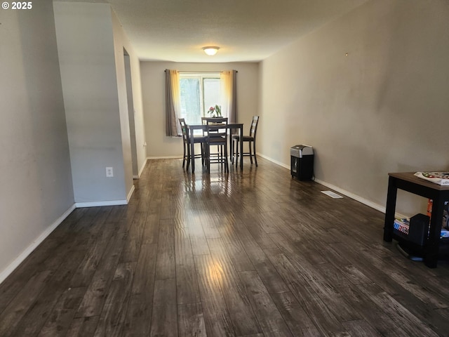 6307 NE Wilding Rd, Vancouver, WA 98686 - dining room featuring dark wood-style floors and baseboards
