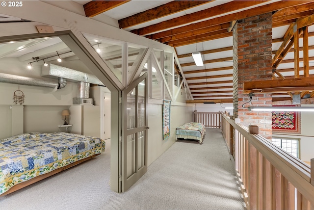 bedroom featuring vaulted ceiling with beams and carpet