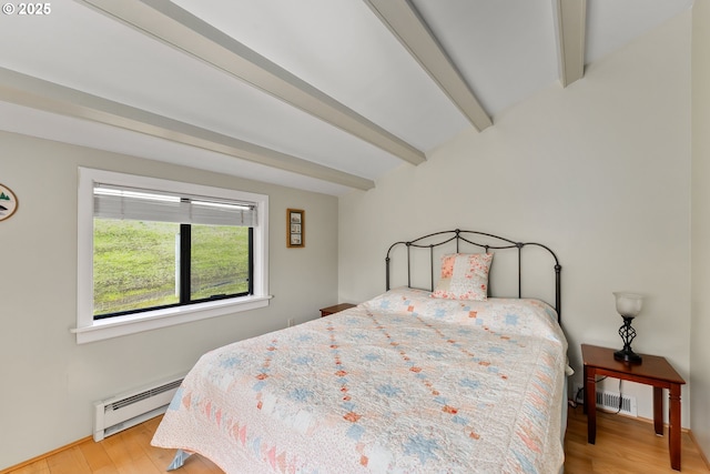 bedroom featuring light wood finished floors, a baseboard radiator, and beam ceiling