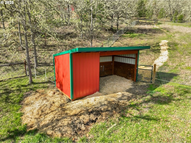 view of pole building with fence