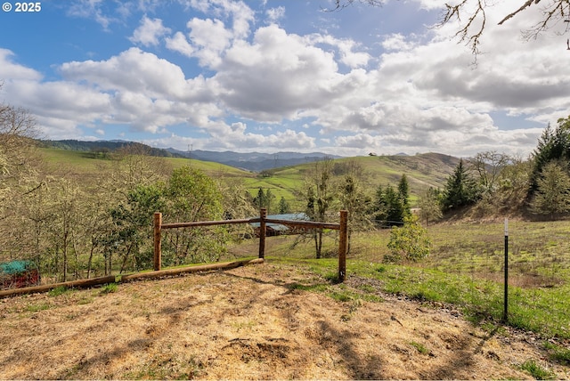 exterior space with a rural view and a mountain view