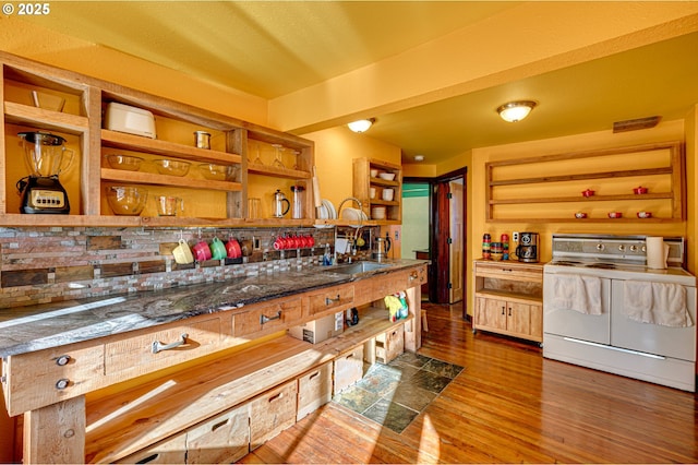 kitchen featuring sink, white electric range, and wood-type flooring