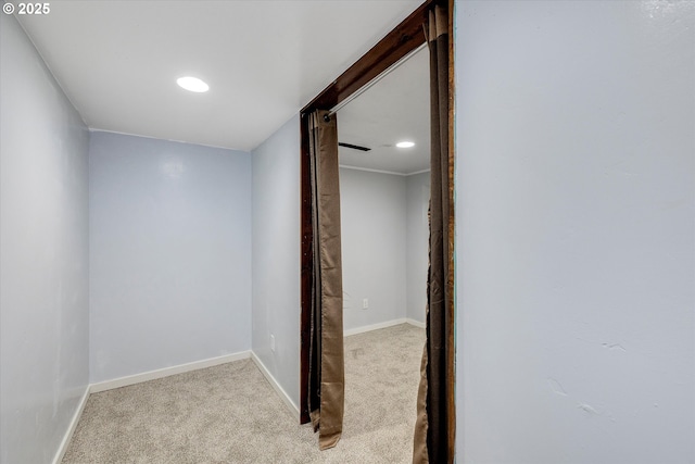 hall featuring light carpet, recessed lighting, and baseboards