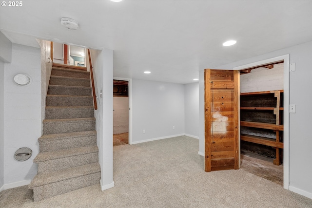 stairs with carpet, baseboards, and recessed lighting