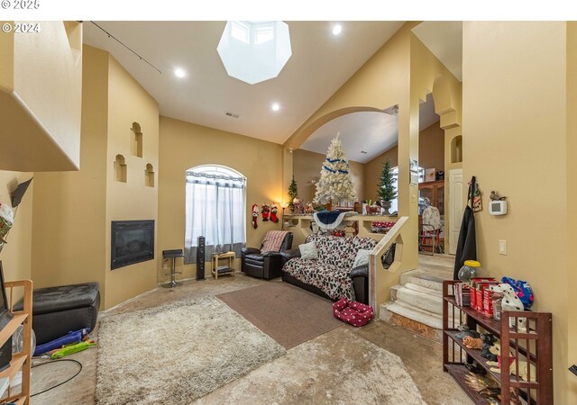 playroom with recessed lighting, vaulted ceiling, visible vents, and a fireplace