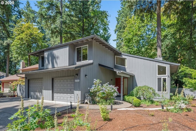 17221 SW Oakenshield Ct, Portland, OR 97224 - mid-century home with a garage and asphalt driveway