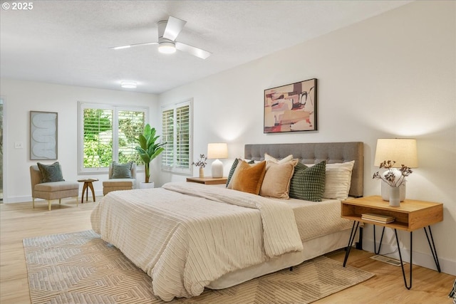 17221 SW Oakenshield Ct, Portland, OR 97224 - bedroom featuring wood finished floors, a ceiling fan, and a textured ceiling