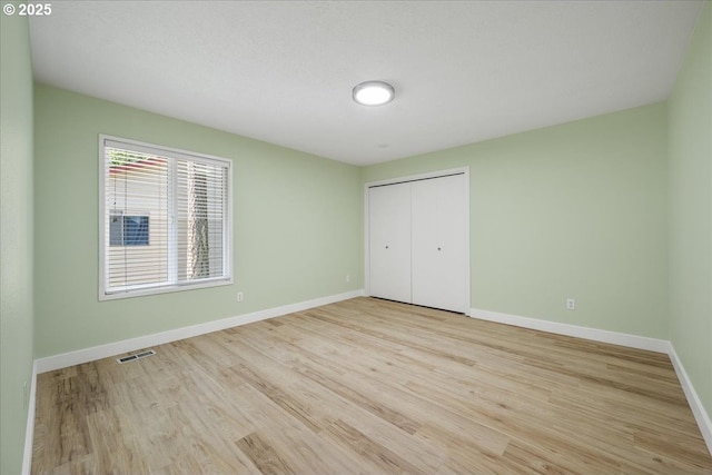 17221 SW Oakenshield Ct, Portland, OR 97224 - unfurnished bedroom featuring light wood-style floors and a closet