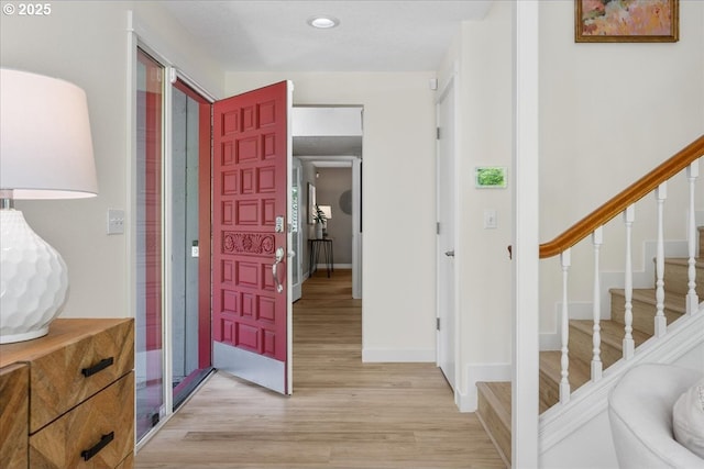 17221 SW Oakenshield Ct, Portland, OR 97224 - entryway with light wood-style flooring, recessed lighting, and stairway