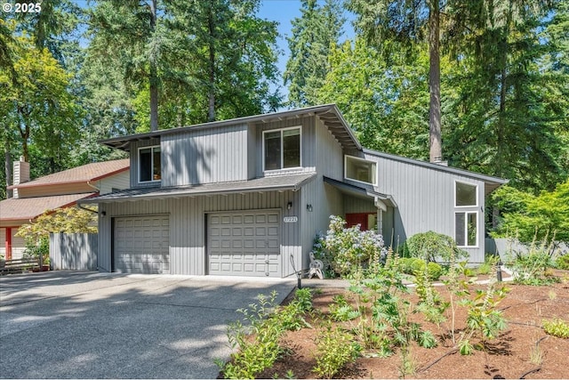 17221 SW Oakenshield Ct, Portland, OR 97224 - view of front of house featuring asphalt driveway and a garage
