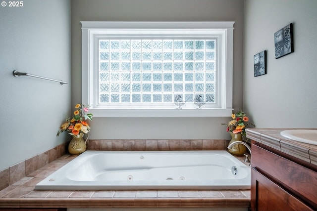 bathroom with vanity and tiled bath