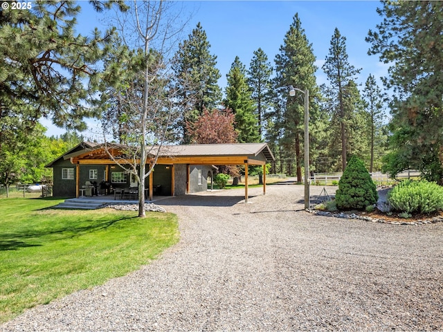 14955 Profitt Loop, Baker City, OR 97814 - view of home's community with gravel driveway, a garage, and an attached carport