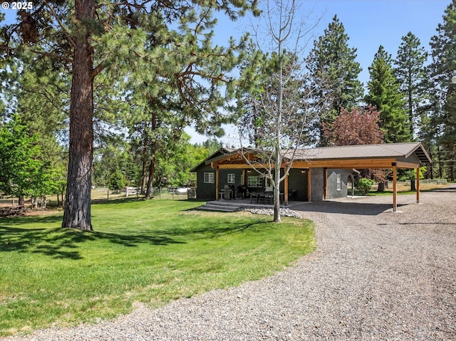 14955 Profitt Loop, Baker City, OR 97814 - view of front of home with gravel driveway, a carport, and a metal roof