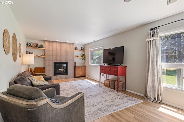 14955 Profitt Loop, Baker City, OR 97814 - living room with light wood-type flooring, a tile fireplace, and recessed lighting