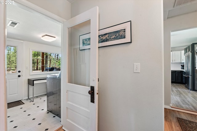 14955 Profitt Loop, Baker City, OR 97814 - doorway with washer / dryer and light wood-type flooring