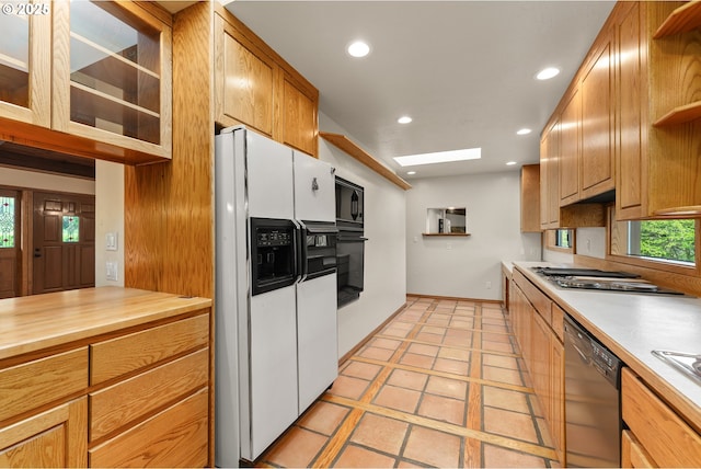 kitchen with open shelves, recessed lighting, baseboards, butcher block counters, and black appliances