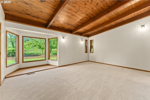 unfurnished room with wooden ceiling, carpet floors, and baseboards