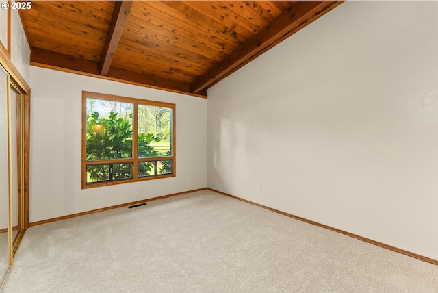 unfurnished room with wooden ceiling, vaulted ceiling with beams, light carpet, and visible vents